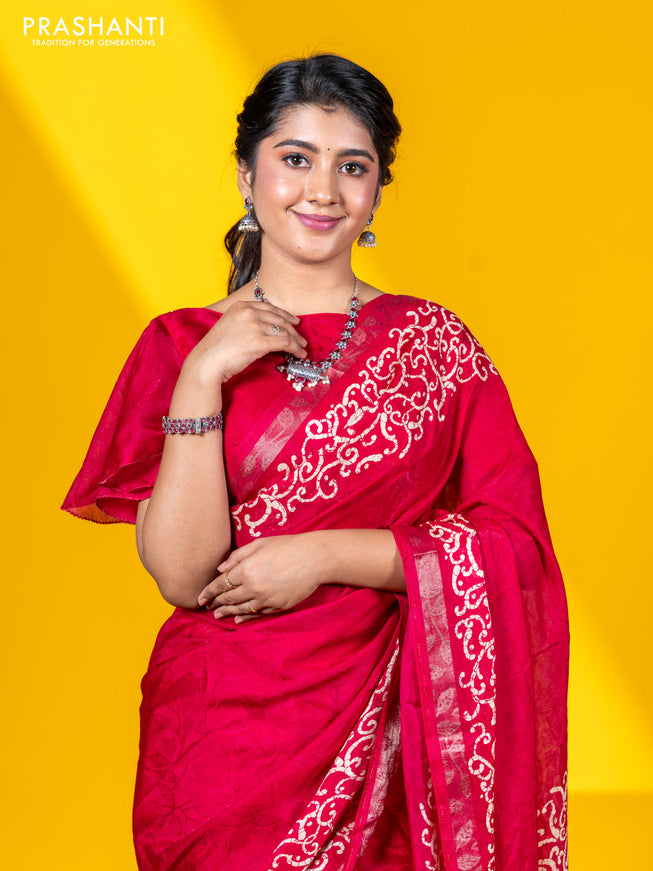 Semi crepe saree tomato pink with allover self emboss and batik printed border