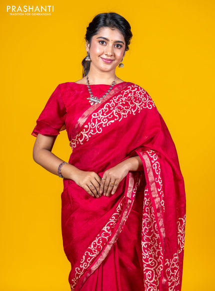 Semi crepe saree tomato pink with allover self emboss and batik printed border