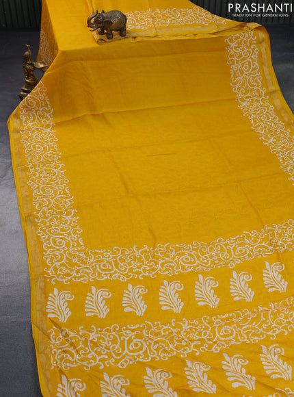 Semi crepe saree mango yellow with allover self emboss and batik printed border