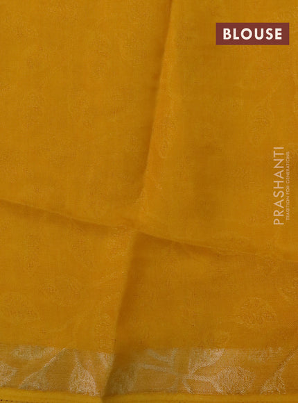 Semi crepe saree mango yellow with allover self emboss and batik printed border