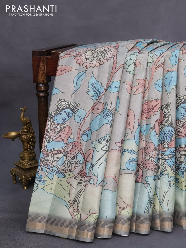 Semi tussar saree pastel grey shade with allover pen kalamkari prints and zari woven border