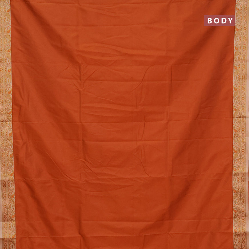 Semi banarasi katan saree rustic orange and beige with plain body and zari woven border