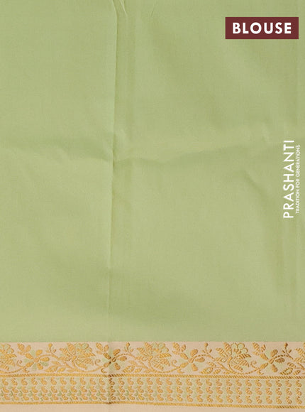 Semi banarasi katan saree pista green and cream with plain body and zari woven border