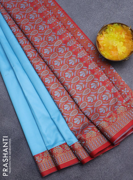 Semi banarasi katan saree light blue and red with plain body and zari woven border