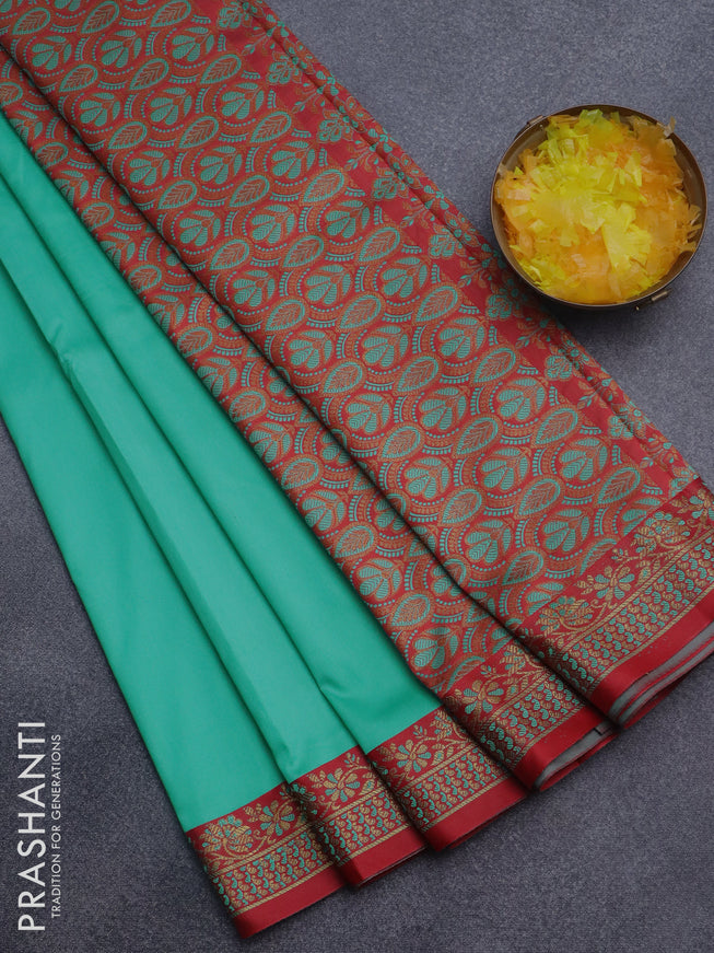 Semi banarasi katan saree teal green and red with plain body and zari woven border