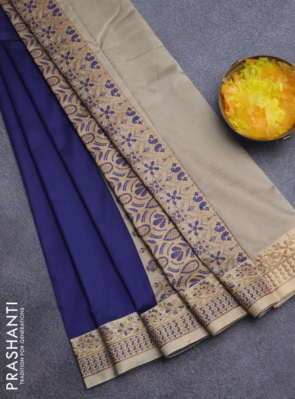 Semi banarasi katan saree navy blue and beige with plain body and zari woven border