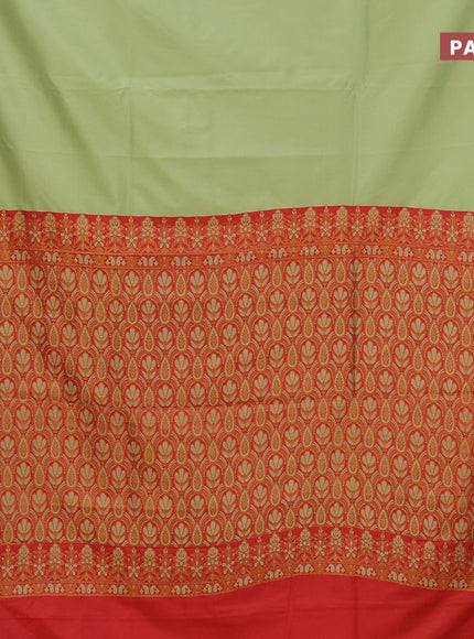 Semi banarasi katan saree pista green and red with plain body and zari woven border