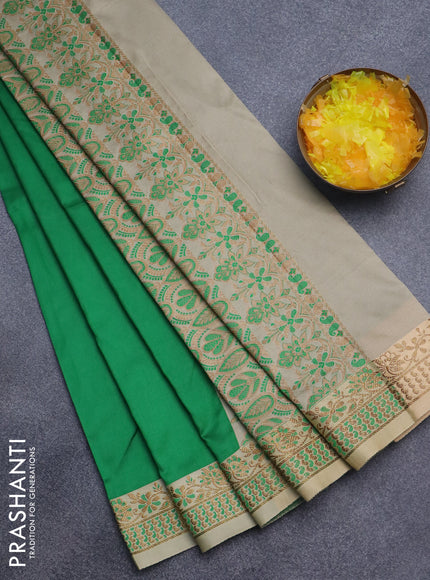 Semi banarasi katan saree green and sandal with plain body and zari woven border