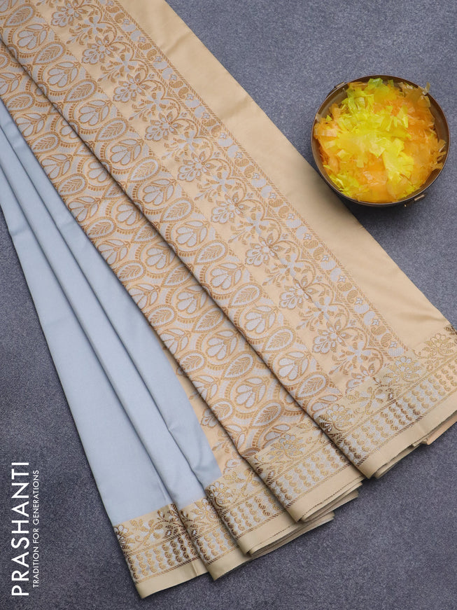 Semi banarasi katan saree pastel grey and sandal with plain body and zari woven border