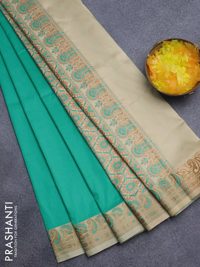 Semi banarasi katan saree teal green and sandal with plain body and thread & zari woven border