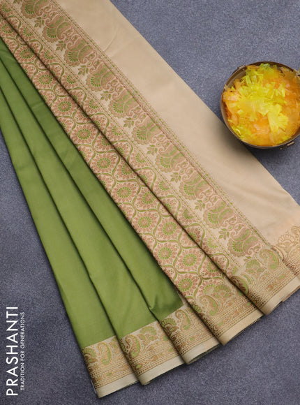 Semi banarasi katan saree mehendi green and cream with plain body and thread & zari woven border