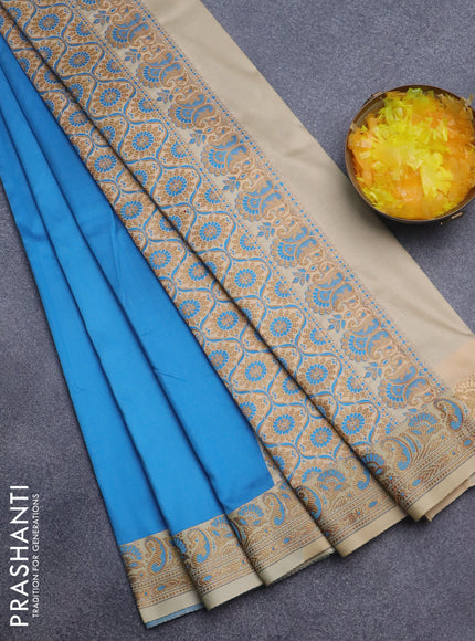 Semi banarasi katan saree cs blue and cream with plain body and thread & zari woven border