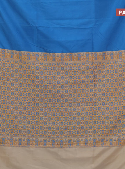 Semi banarasi katan saree cs blue and cream with plain body and thread & zari woven border