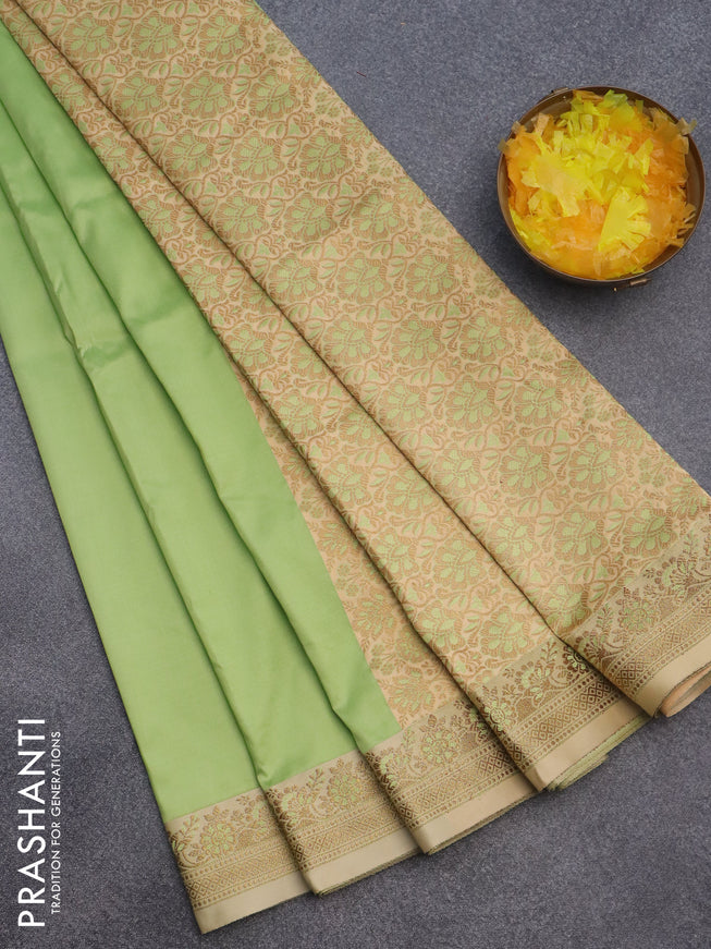 Semi banarasi katan saree pista green and sandal with plain body and zari woven border