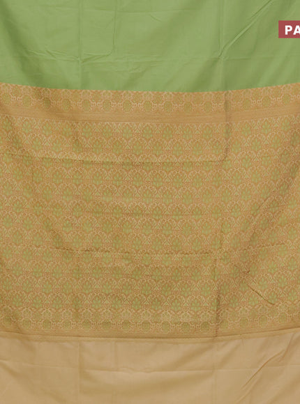 Semi banarasi katan saree pista green and sandal with plain body and zari woven border