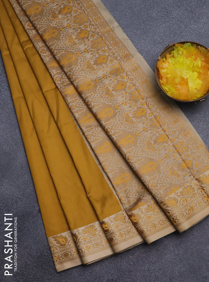 Semi banarasi katan saree mustard yellow and beige with plain body and zari woven border