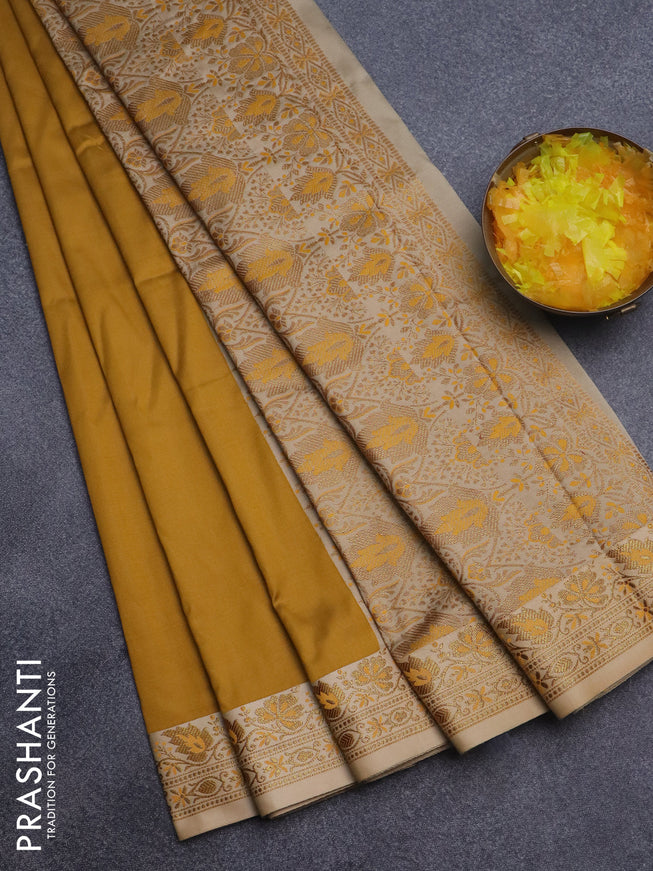 Semi banarasi katan saree mustard yellow and beige with plain body and zari woven border