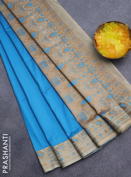 Semi banarasi katan saree cs blue and beige with plain body and zari woven border