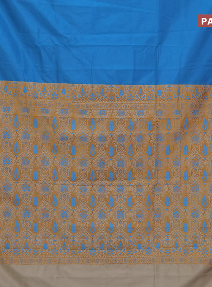 Semi banarasi katan saree cs blue and beige with plain body and zari woven border