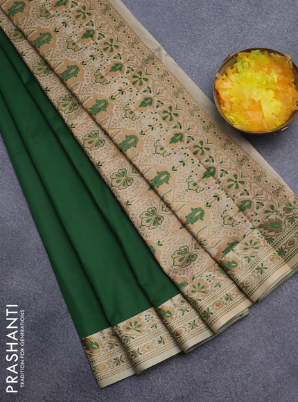 Semi banarasi katan saree dark green and beige with plain body and zari woven border