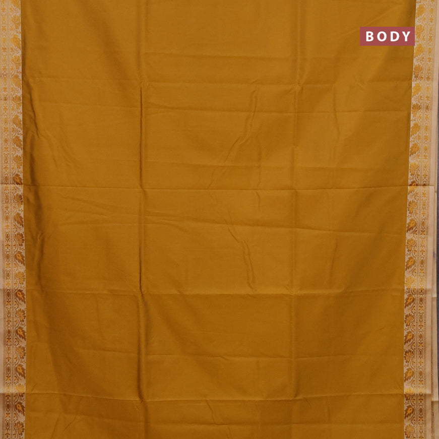 Semi banarasi katan saree mustard yellow and beige with plain body and zari woven border