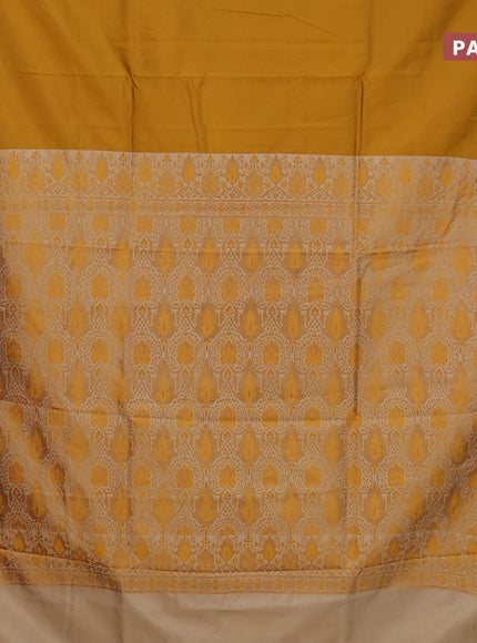 Semi banarasi katan saree mustard yellow and beige with plain body and zari woven border