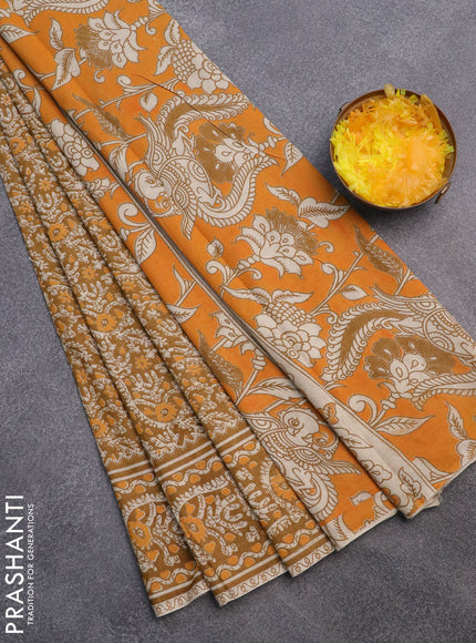 Kalamkari cotton saree dark mustard with allover batik prints and printed border