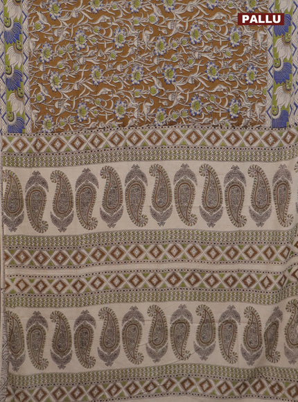 Kalamkari cotton saree dark mustard and green with allover prints and printed border