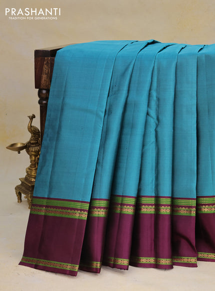 Pure kanchipuram silk saree peacock blue and wine shade with zari woven buttas and rettapet zari woven border