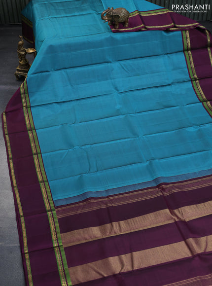 Pure kanchipuram silk saree peacock blue and wine shade with zari woven buttas and rettapet zari woven border