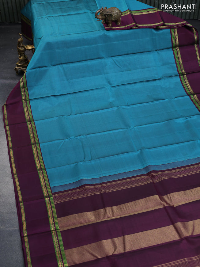 Pure kanchipuram silk saree peacock blue and wine shade with zari woven buttas and rettapet zari woven border