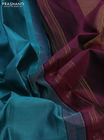 Pure kanchipuram silk saree peacock blue and wine shade with zari woven buttas and rettapet zari woven border