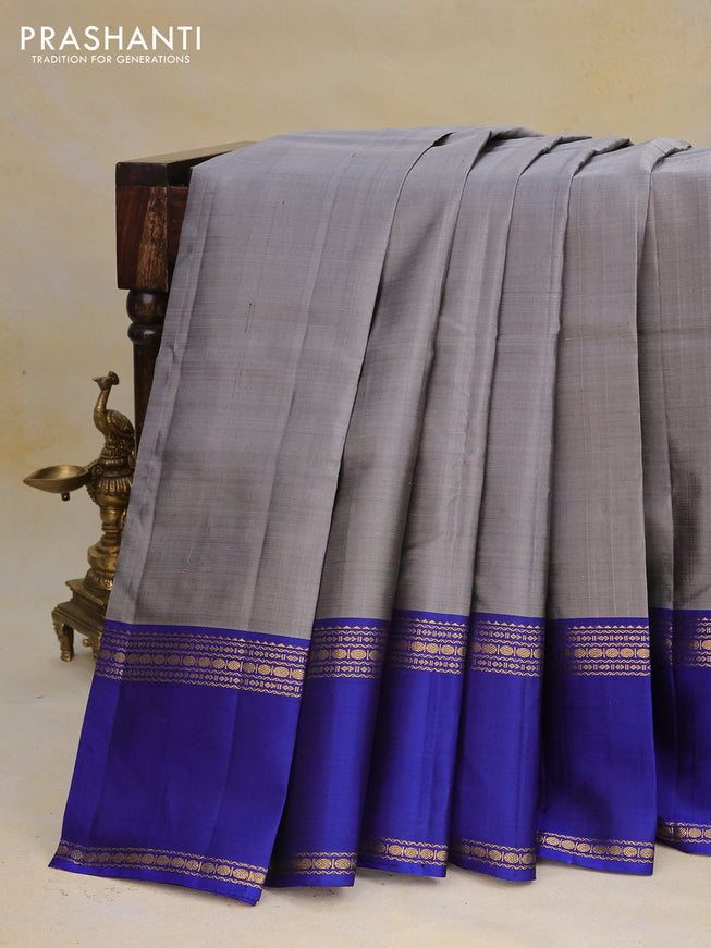 Pure kanchipuram silk saree grey and blue with plain body and rettapet zari woven border