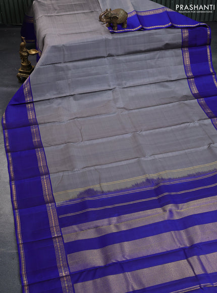 Pure kanchipuram silk saree grey and blue with plain body and rettapet zari woven border