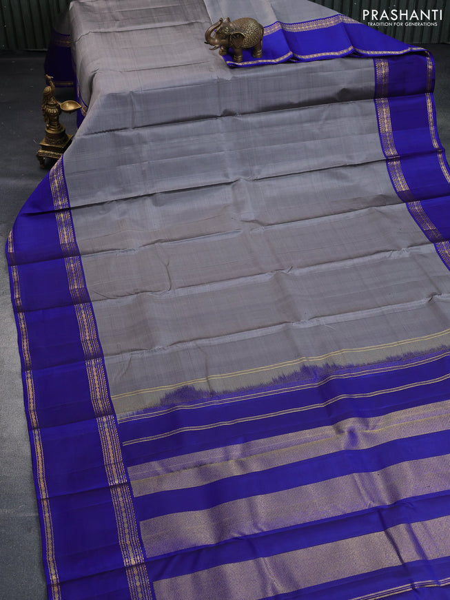 Pure kanchipuram silk saree grey and blue with plain body and rettapet zari woven border