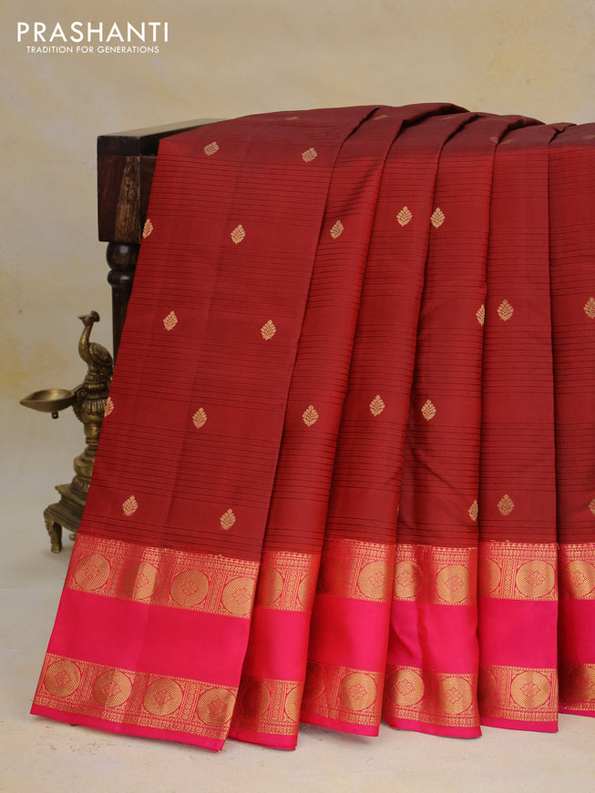 Pure kanchipuram silk saree maroon and dual shade of pinkish orange with allover self emboss & zari buttas and rettapet zari woven border