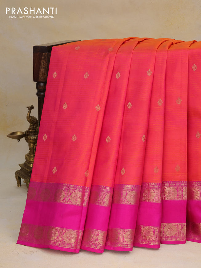 Pure kanchipuram silk saree dual shade of pinkish orange and pink with allover self emboss & zari buttas and rettapet zari woven border