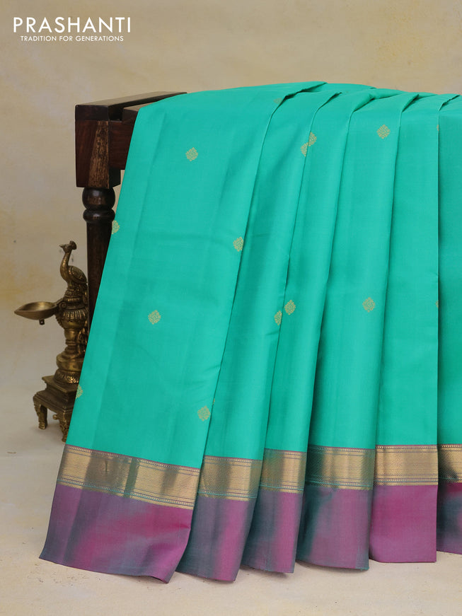 Pure kanchipuram silk saree teal green and pink with zari woven buttas and zari woven simple border