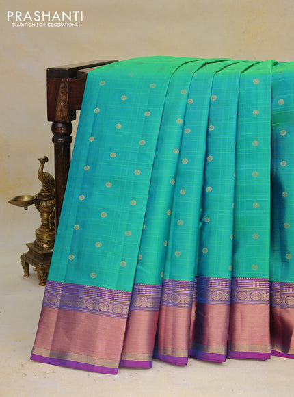 Pure kanchipuram silk saree dual shade of green and dual shade of purple with allover self emboss & zari buttas and rich zari woven border