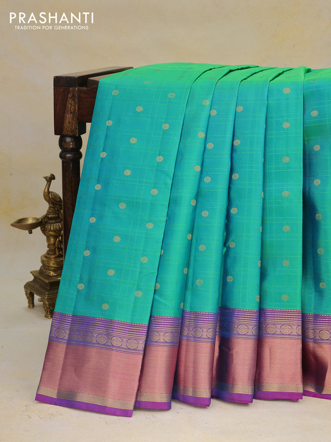 Pure kanchipuram silk saree dual shade of green and dual shade of purple with allover self emboss & zari buttas and rich zari woven border