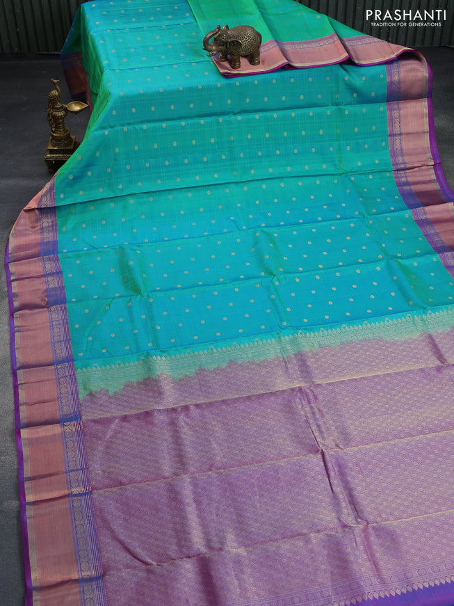 Pure kanchipuram silk saree dual shade of green and dual shade of purple with allover self emboss & zari buttas and rich zari woven border