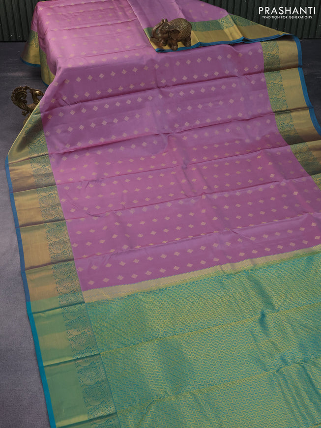 Pure kanchipuram silk saree lavender shade and teal green with allover zari woven buttas and annam zari woven border