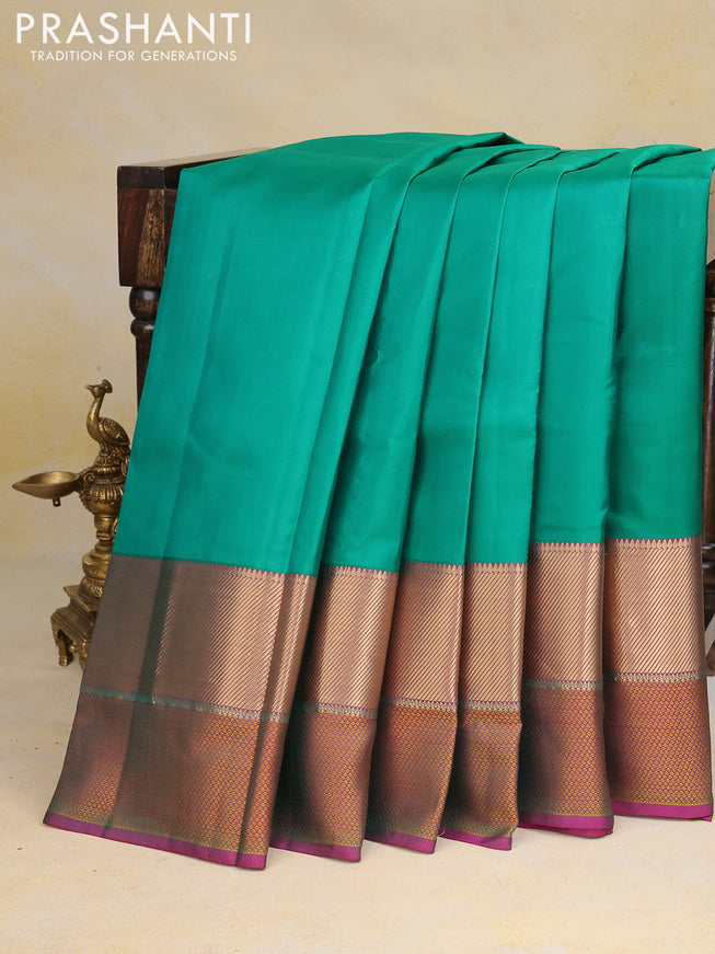 Pure kanchipuram silk saree green and pink with plain body and thread & zari woven border