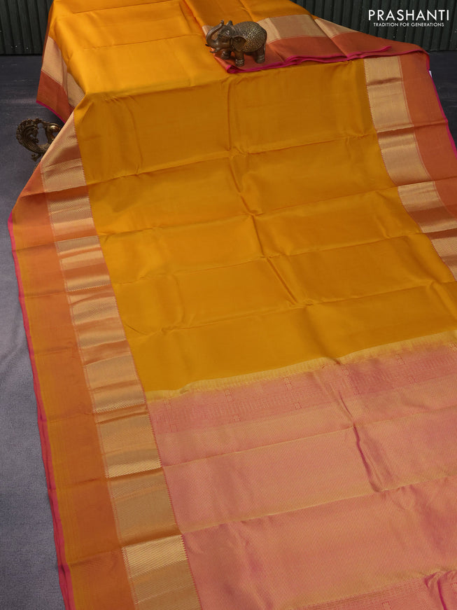 Pure kanchipuram silk saree mustard yellow and pink with plain body and thread & zari woven border