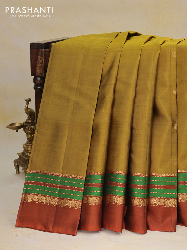 Pure kanchipuram silk saree mustard yellow and rustic orange with plain body and zari woven border