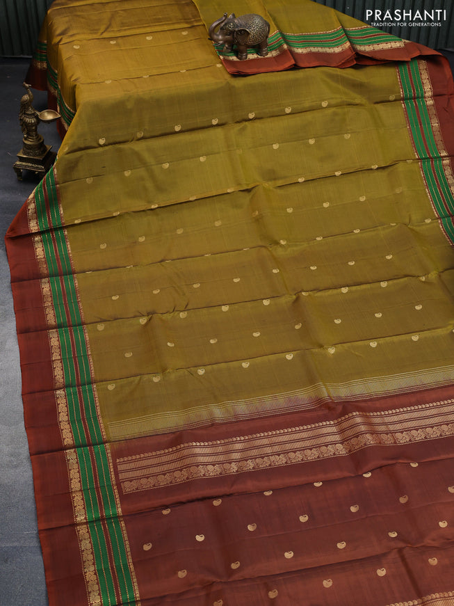 Pure kanchipuram silk saree mustard yellow and rustic orange with plain body and zari woven border