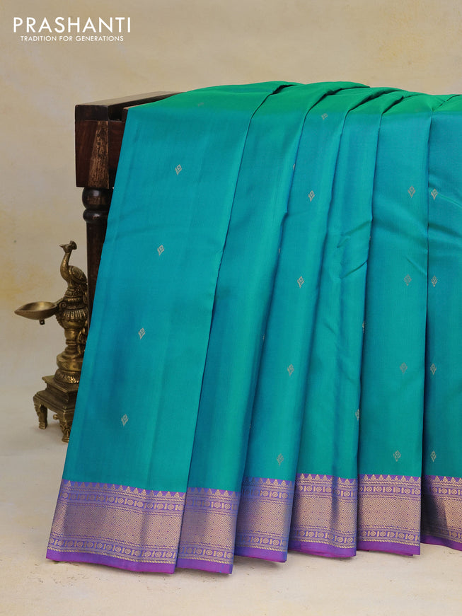 Pure kanchipuram silk saree dual shade of teal bluish green and dual shade of purple with zari woven buttas and zari woven border