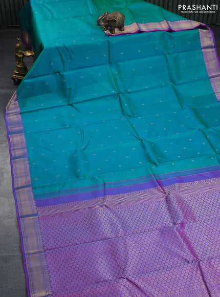 Pure kanchipuram silk saree dual shade of teal bluish green and dual shade of purple with zari woven buttas and zari woven border