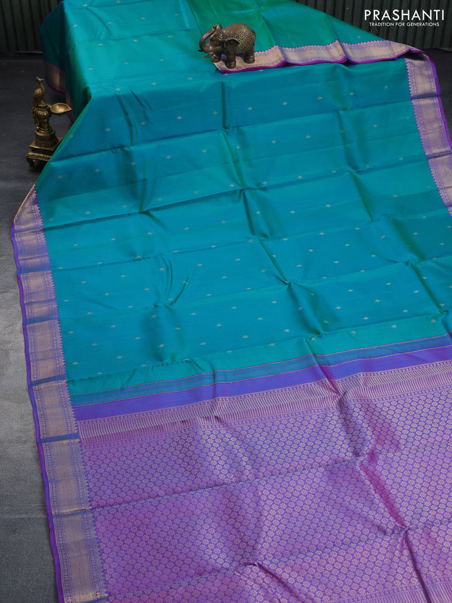 Pure kanchipuram silk saree dual shade of teal bluish green and dual shade of purple with zari woven buttas and zari woven border