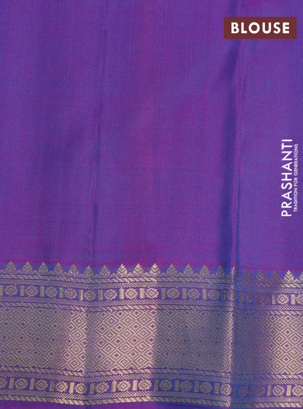 Pure kanchipuram silk saree dual shade of teal bluish green and dual shade of purple with zari woven buttas and zari woven border